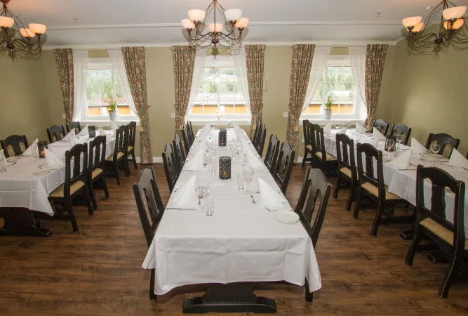 A room with a table and chairs.