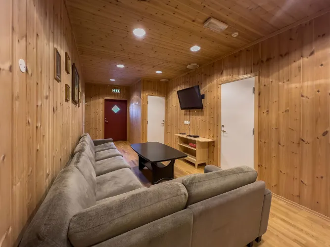 TV room with sofas and a table.