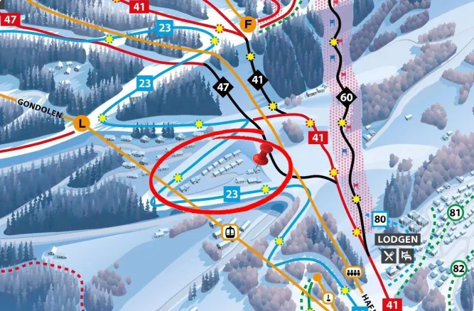 Illustrativer Skipistenplan mit farbigen Routen, Nummern, Gondel-Icon und rot eingekreistem Gebiet mit Stecknadel..