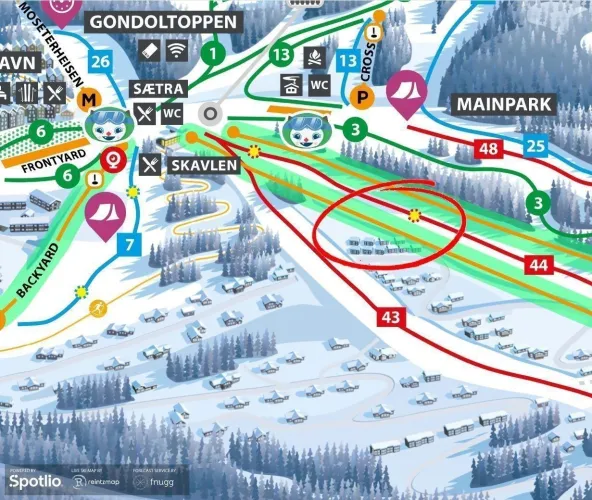 Illustrative Skigebietskarte mit farbigen Pisten, Liften und Symbolen; ein Bereich rechts ist rot eingekreist..